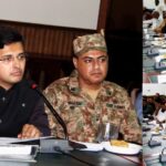 گرمی کی شدت سے بچنے کیلئے ایک مزدور ٹرالی کے سائے کےنیچے بیٹھاہواھے